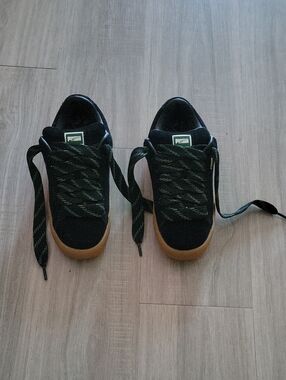Puma Kids Black Suede Sneakers with Gum Outsole and Green Accents